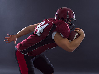 Image showing American football Player running with the ball