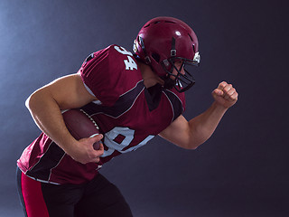 Image showing American football Player running with the ball