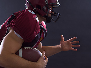 Image showing American football Player running with the ball