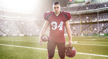 Image showing American Football Player isolated on big modern stadium field