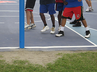 Image showing basketball players on a court