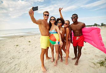 Image showing happy friends taking selfie on summer beach