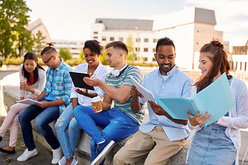 Image showing group of happy students with notebooks and drinks