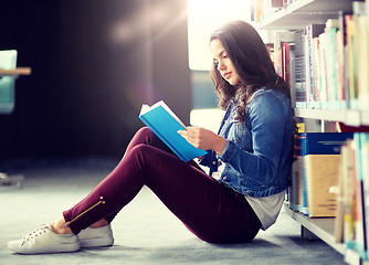 Image showing high school student girl reading book at library