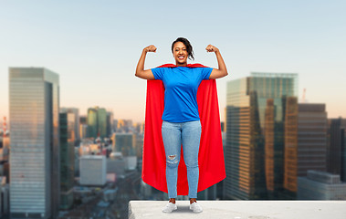 Image showing happy african american woman in superhero red cape