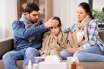 Image showing family with ill daughter having fever at home