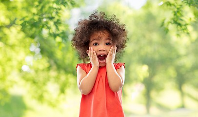 Image showing surprised little african american girl in summer