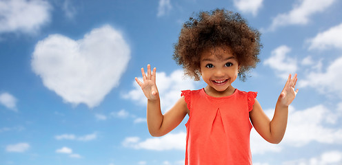 Image showing happy little african american girl over blue sky