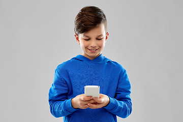 Image showing smiling boy in blue hoodie