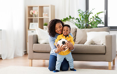 Image showing mother and baby playing with soccer ball at home