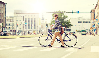 Image showing young man with fixed gear bicycle on crosswalk