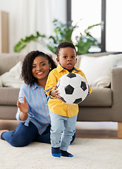 Image showing mother and baby playing with soccer ball at home