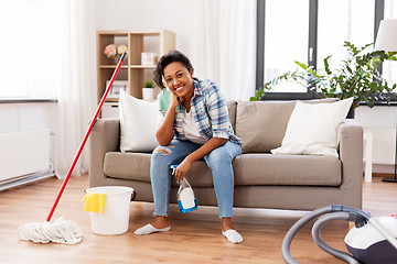 Image showing african woman or housewife after cleaning at home