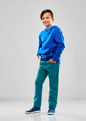 Image showing smiling boy in blue hoodie