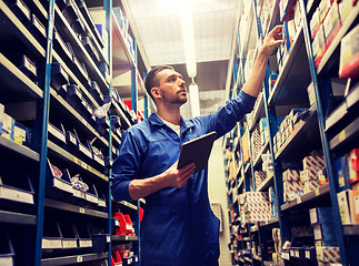 Image showing auto mechanic or smith with tablet pc at workshop