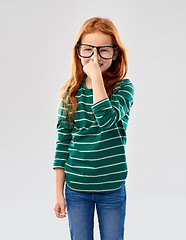 Image showing smiling red haired student girl in glasses