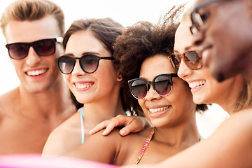 Image showing close up of happy friends in sunglasses in summer