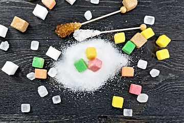 Image showing Sugar of different colors and shapes on board top