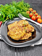 Image showing Fritters meat in plate on black board