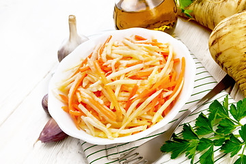 Image showing Salad of parsnip and carrot on light board