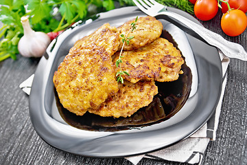 Image showing Fritters meat in plate on black wooden board