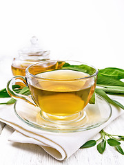 Image showing Tea herbal with sage in cup on light wooden board