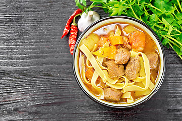 Image showing Lagman in bowl on black board top