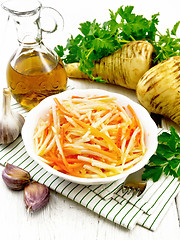 Image showing Salad of parsnip and carrot on white board