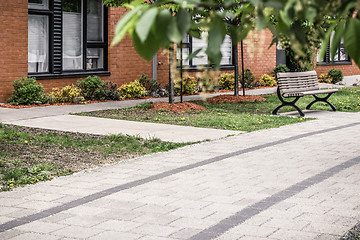 Image showing Paved path leading to a modern brick building