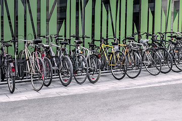 Image showing Bicycles near a green wall