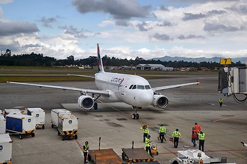 Image showing Airplne arriving at the airport, connecting jetbridge