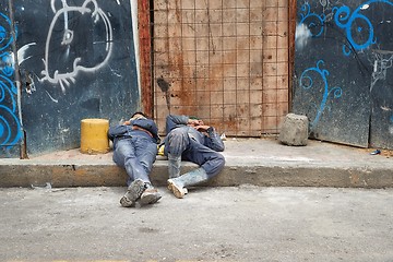 Image showing Workers sleeping on a construction site