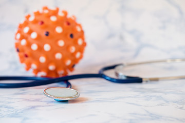 Image showing Medical stethoscope or phonendoscope over light blue background Tablet in the fingers of hand