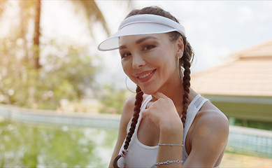 Image showing Cheerful sportswoman smiling for camera