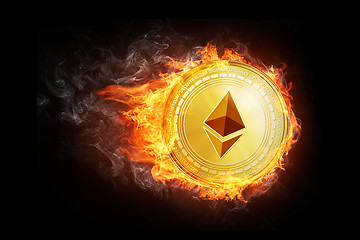 Image showing Golden ethereum coin flying in fire flame.