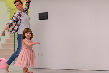 Image showing mom and little daughter spending time together at home