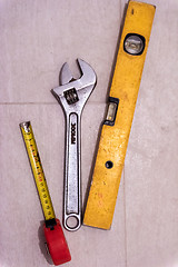 Image showing set of hand working tools on ceramic tile background