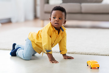 Image showing african american baby boy playing with toy car