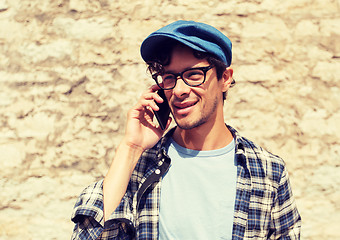 Image showing close up of man calling on smartphone outdoors