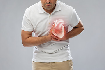 Image showing close up of man having heart attack or heartache