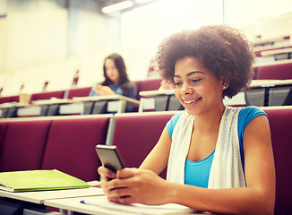 Image showing african student girl with smartphone at lecture