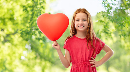 Image showing smiling red haired girl with heart shaped balloon