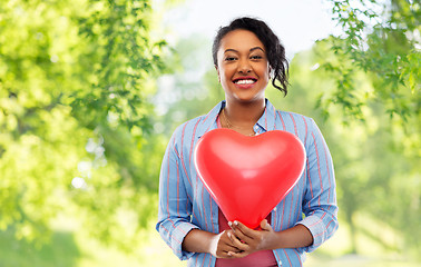 Image showing african american woman with heart-shaped balloon