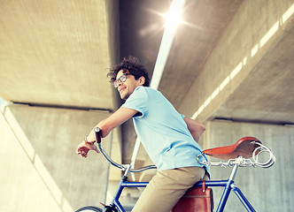 Image showing young hipster man riding fixed gear bike