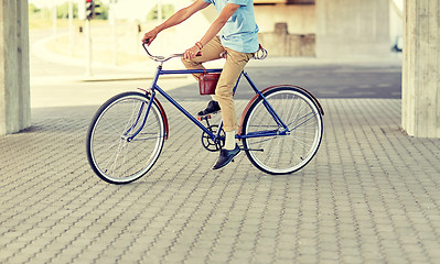 Image showing hipster man riding fixed gear bike