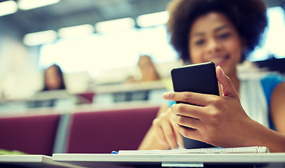 Image showing close up of african student with smartphone