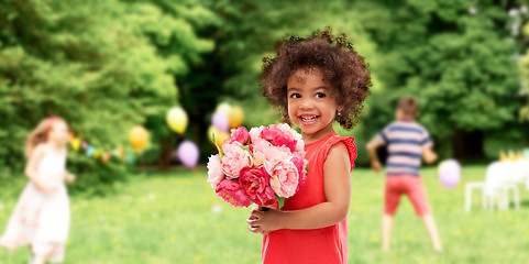 Image showing happy little african american girl with flowers