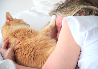 Image showing Female and her cat.