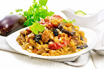 Image showing Rice with vegetables and chicken in plate on light board