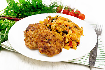 Image showing Fritters meat with cabbage in plate on wooden board